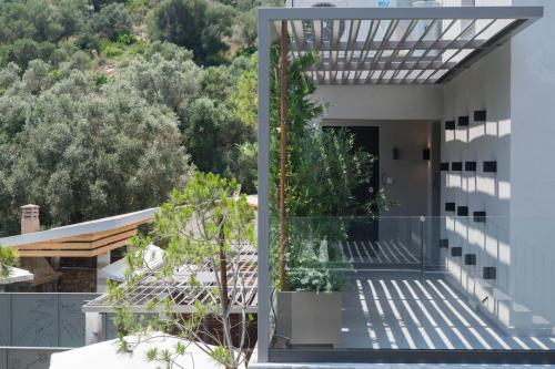a house with a view of the garden at September15 Suites- Meganisi in Meganisi
