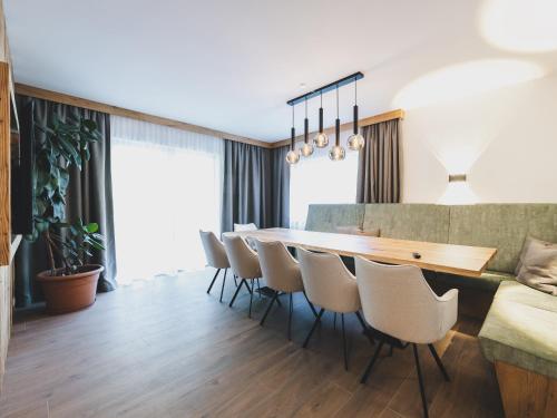 a dining room with a table and chairs at NEW! Chalet Carina by we rent in Zell am See