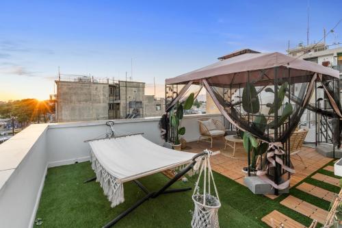a balcony with a hammock and a gazebo at Heart Of Nicosia - The Gem in Nicosia