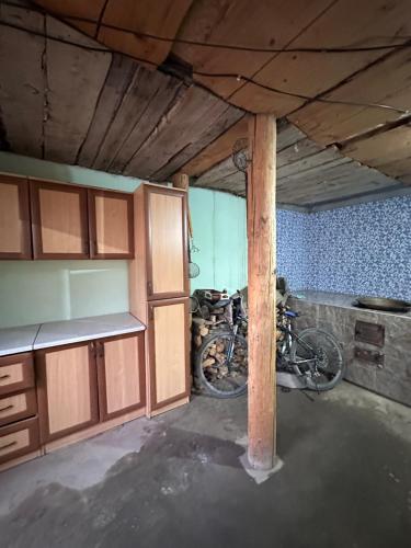 a kitchen with two bikes parked in a room at Дом для отдыха in Pokrovka