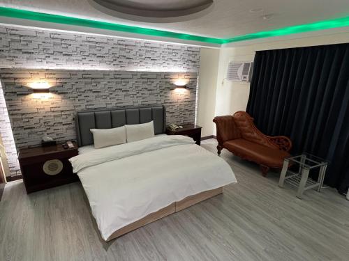 Ένα ή περισσότερα κρεβάτια σε δωμάτιο στο Hua Du Motel