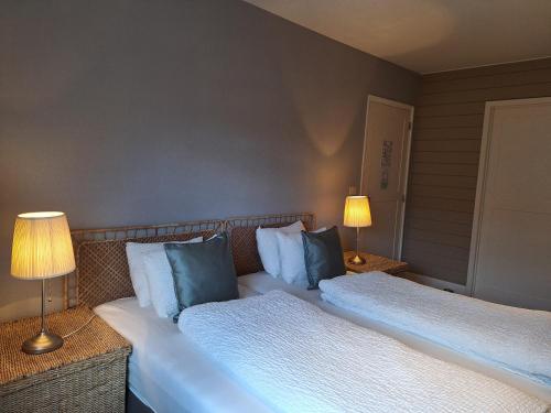 Casa-Cosi, tourist & business suites & flats with reserved parking included, private sauna bookableにあるベッド