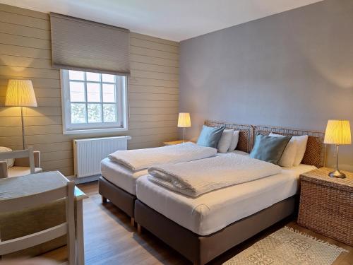 Casa-Cosi, tourist & business suites & flats with reserved parking included, private sauna bookableにあるベッド