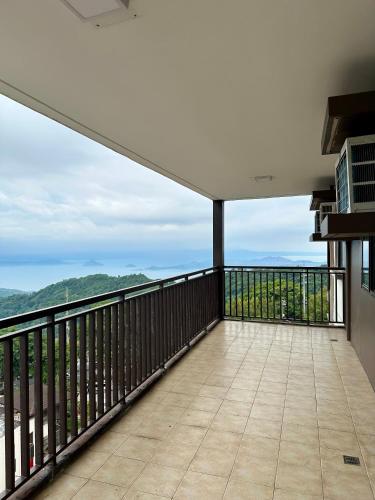 a balcony with a view of the ocean at Tagaytay Staycation - Balaico 2 balconies Taal View 2BR in Tagaytay