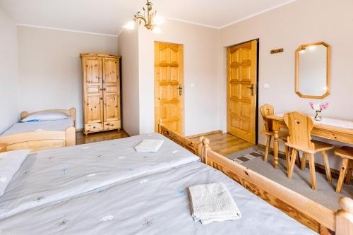 Postel nebo postele na pokoji v ubytování Agrozacisze