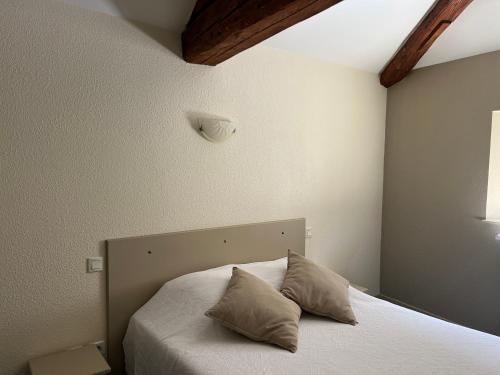 Postel nebo postele na pokoji v ubytování Auberge de la Planèze