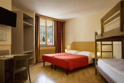 Postel nebo postele na pokoji v ubytování Hotel Portavescovo