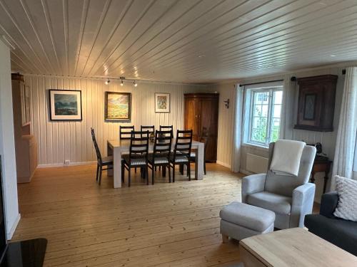 a dining room with a table and chairs at Cozy 2 bedroom house on a farm just outside Lillestrøm in Lillestrøm