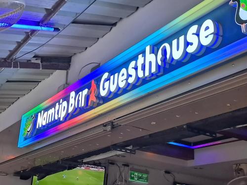 a sign at a gas station that reads knights beltswick at Namtip Bar & Guesthouse in Pattaya