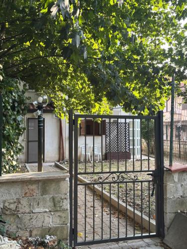 an iron gate in front of a house at Villa Madonnina in riva al fiume Tirino in Bussi sul Tirino