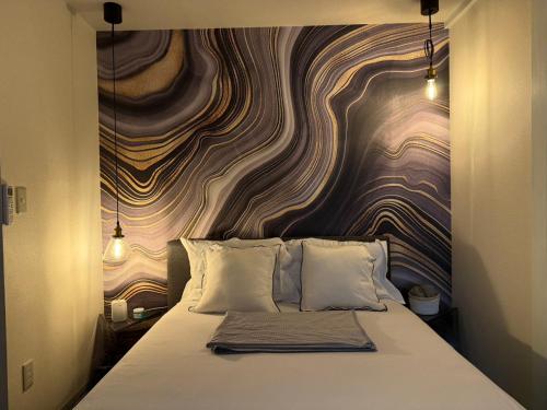 Una cama o camas en una habitación de ボーマンボウ 呆呆的翻车鱼 Mola Mola