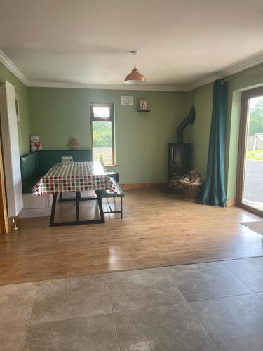 a room with a table in the middle of a room at Homestay Large Ensuite Room in Balnacart