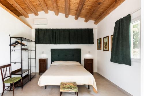 Agriturismo Val Di Notoにあるベッド