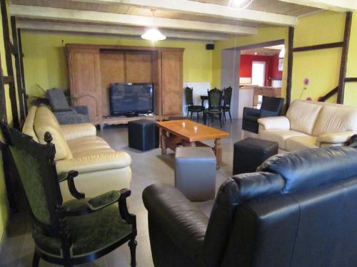 a living room with couches and a tv at Lovely house with much luxury and comfort in Waimes