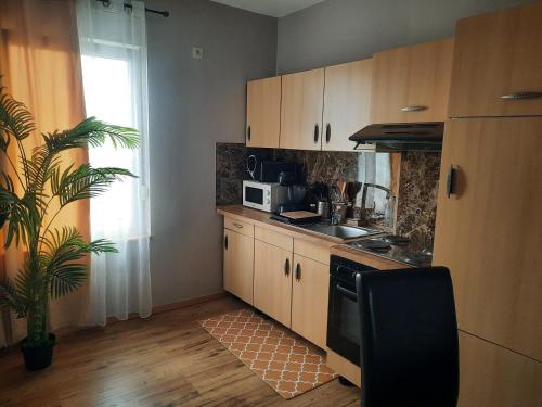 Dapur atau dapur kecil di Sunny days Cozy apartment
