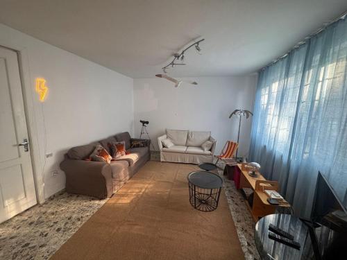 a living room with a couch and a table at Dream house Chakvi in Chakvi