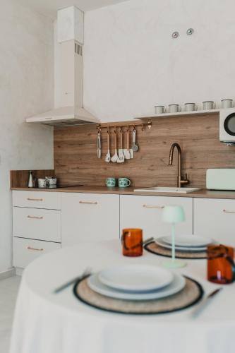 a kitchen with a sink and a plate on a counter at Domus Templi in Caravaca de la Cruz