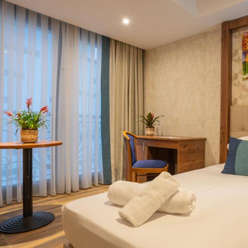Katil atau katil-katil dalam bilik di Hotel Ain benian