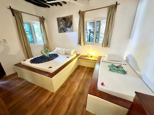 Letto o letti in una camera di HEBE Bungalows Lodge