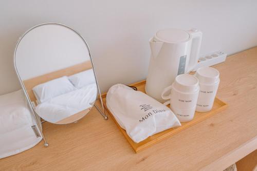 a counter with a mirror and some products on it at Jeju Mon Dieu Hotel in Jeju