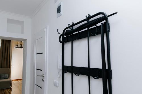 a bedroom with white walls and a black and white closet at Budapest-Zuglo in Budapest