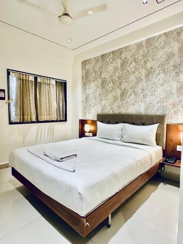 Postel nebo postele na pokoji v ubytování Hotel StayBird - Cove