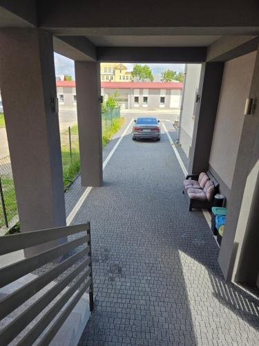 a car parked in a parking lot with a car parked at Apartamenty KORONA in Krosno