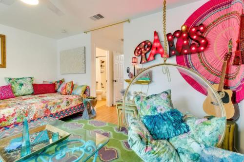 a living room with a couch and a chandelier at Bright Georgetown Gem N Blue Hole Park w Swings in Georgetown