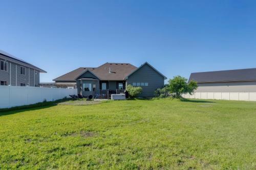 a yard with houses and a fence at Rigby Gem with Hot Tub Theater Game Room Grill in Rigby