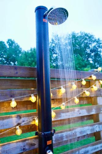 a water fountain with a net on a fence at Entire house with hot tub and beachfront in Köping