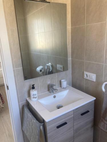 a bathroom with a sink and a mirror at Casa Tia, Mojácar with Private Pool and less than 5 minutes from beach! in Mojácar
