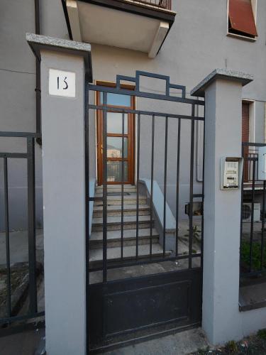 an entrance to a building with a gate and stairs at Oltrepo' Guest House in Voghera
