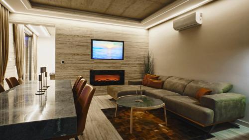 a living room with a couch and a table at Villa Terra in Plešivica
