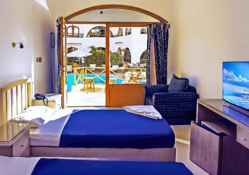 Postel nebo postele na pokoji v ubytování Red Sea Relax Hotel