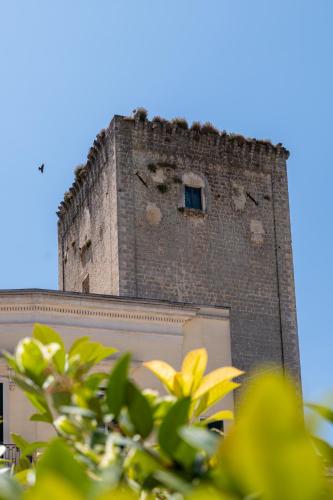 a tall brick tower on top of a building at Casa Agata in Leverano