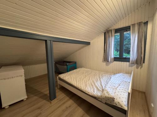Ένα ή περισσότερα κρεβάτια σε δωμάτιο στο Sandy House