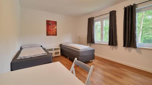 เตียงในห้องที่ Monteurwohnungen - Romika Apartments - Nähe Trier - großer Parkplatz
