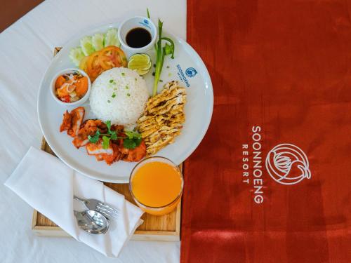 a plate of food with rice and a cup of coffee at SoonNoeng Resort in Koh Rong Sanloem