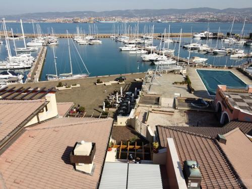 a view of a marina with boats in the water at vitamaris Wellness Apartment & Spa in Muggia