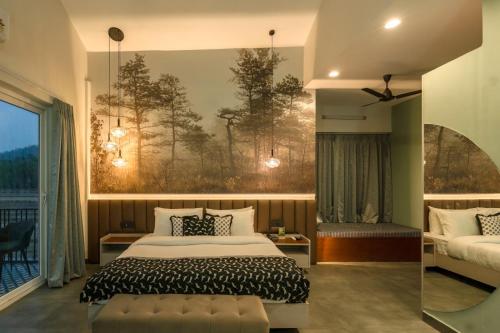 a bedroom with a bed and a large painting on the wall at Srina Vilas, Corbett in Rāmnagar