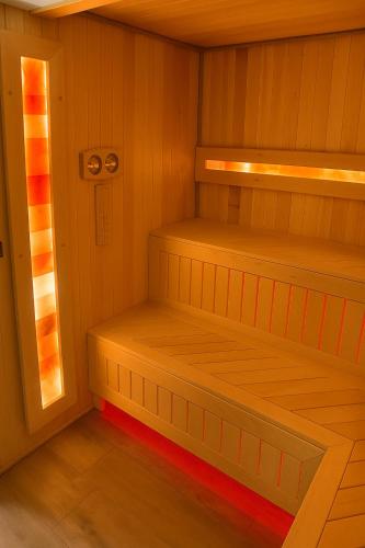 a sauna with two wooden bunk beds in it at Willa Zdrojowa PARK Sauna, Jacuzzi, Fitness in Busko-Zdrój