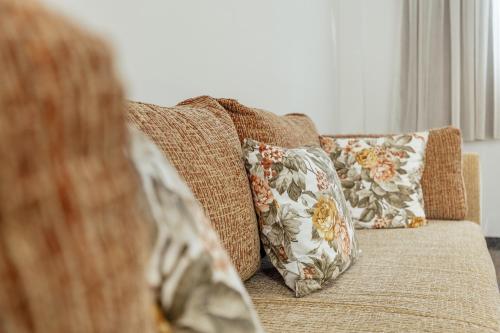 a couch with two pillows on top of it at *NEW IN 2025* - Hotel Subra Atrium in Herceg-Novi