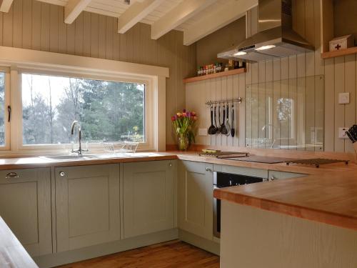 a kitchen with a sink and a window at Glen Hideaway in Balnald
