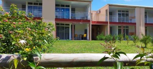 a view of a building with a yard at Le Kanmpo in Trois-Îlets