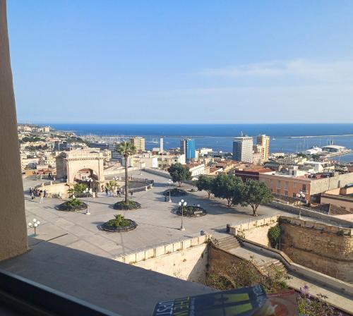 a view of a city with the ocean in the background at Saint Amand by Palazzo Boyl in Cagliari