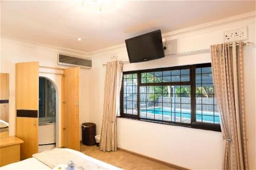 Μια τηλεόραση ή/και κέντρο ψυχαγωγίας στο Buckleigh Guesthouse