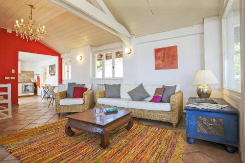 a living room with a couch and a coffee table at Appartamento Ronco in Ghiffa