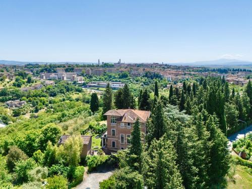 an aerial view of a house in the trees at Villa Elvira 1931 in Siena