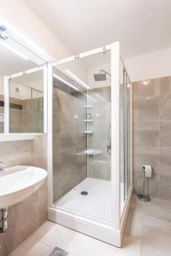 a bathroom with a shower and a sink at Villa Orka in Omišalj