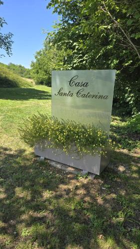 a sign for a park with yellow flowers at Casa S. Caterina in Piaia